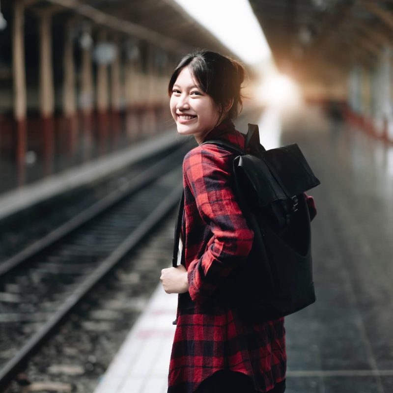 young-traveler-woman-looking-for-friend-planning-trip-at-train-station-summer-and-travel-lifestyle-1.jpg